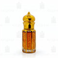 Gold bottle of Black Oud 212 with smoke and wood chips on a dark background, featuring the Qasmi brand. 6ML