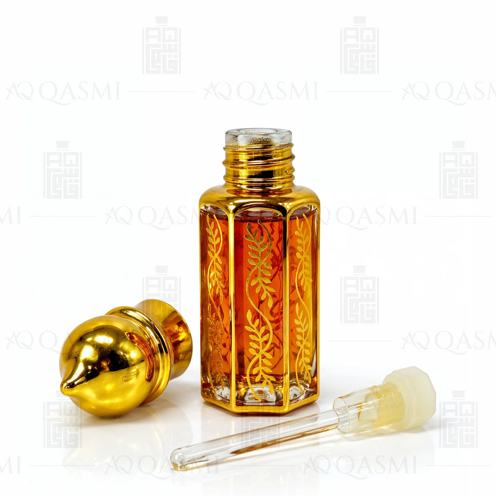 Gold bottle of Black Oud 212 with smoke and wood chips on a dark background, featuring the Qasmi brand. 6ML