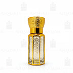 Gold and clear Gucci Flora perfume bottle with lemons and flowers on a light background. 6ML
