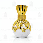 Decorative vase with gold top and white base on a white background