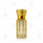 Decorative gold and clear glass perfume bottle with dropper on a white background. 12ML